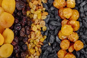 Top view assortment dried fruits apricots raisins cherries cherry plums 300x200